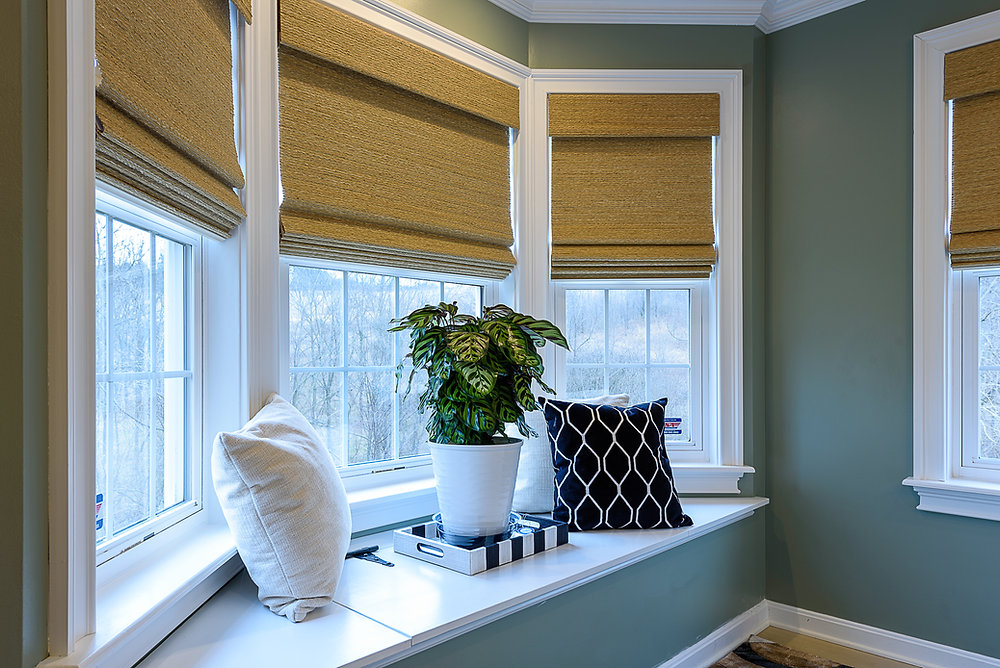 Natural woven wood shades bring the feeling of the outdoors inside